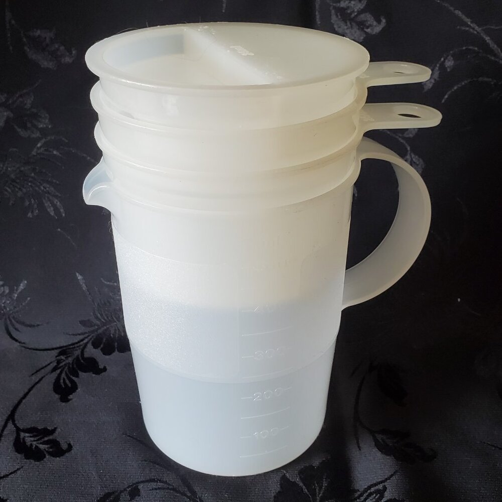 Tupperware Millilitres Metric Measuring Cups 4 Piece Stackable Vintage Clear